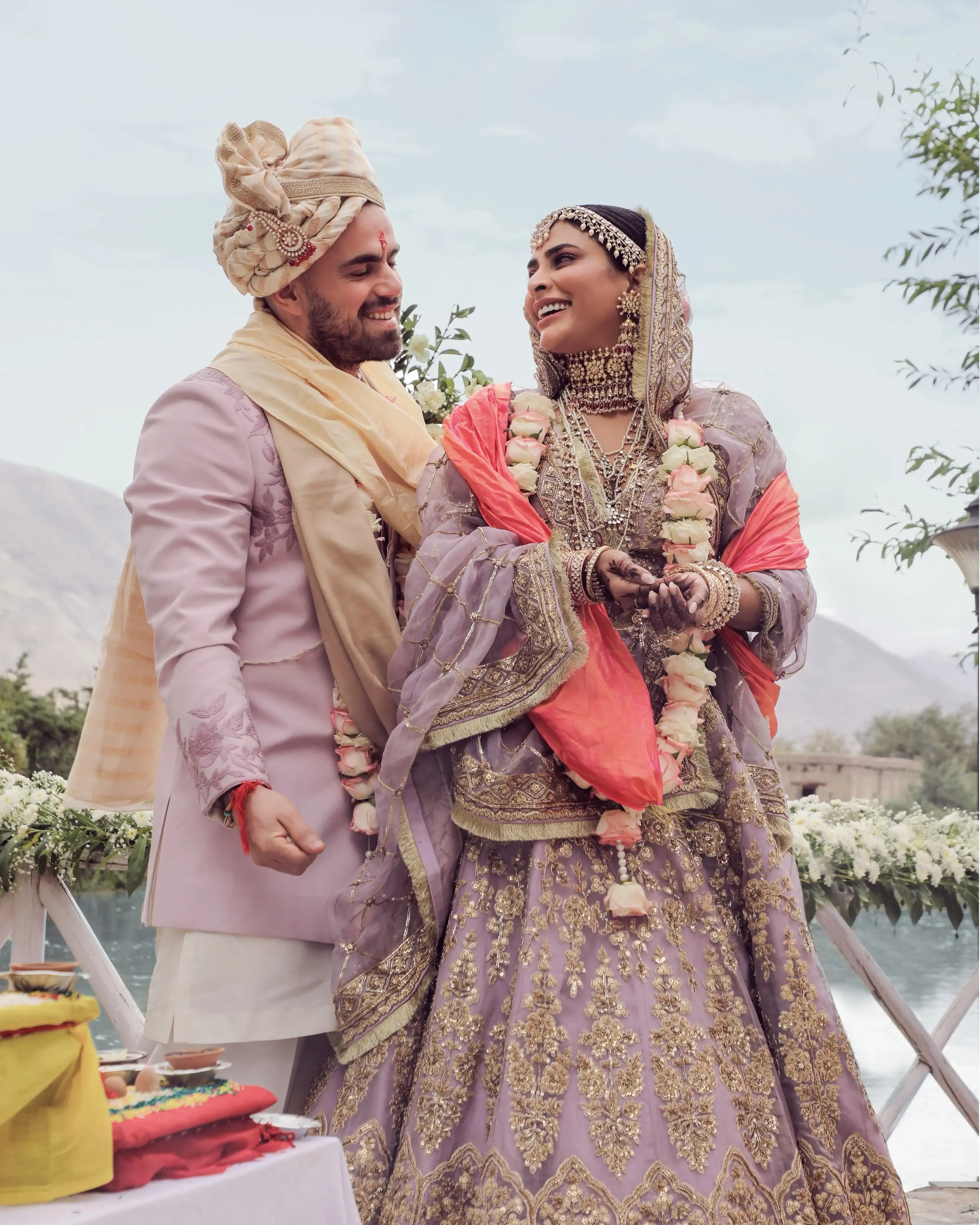 Bride and groom laughing together after the varmala